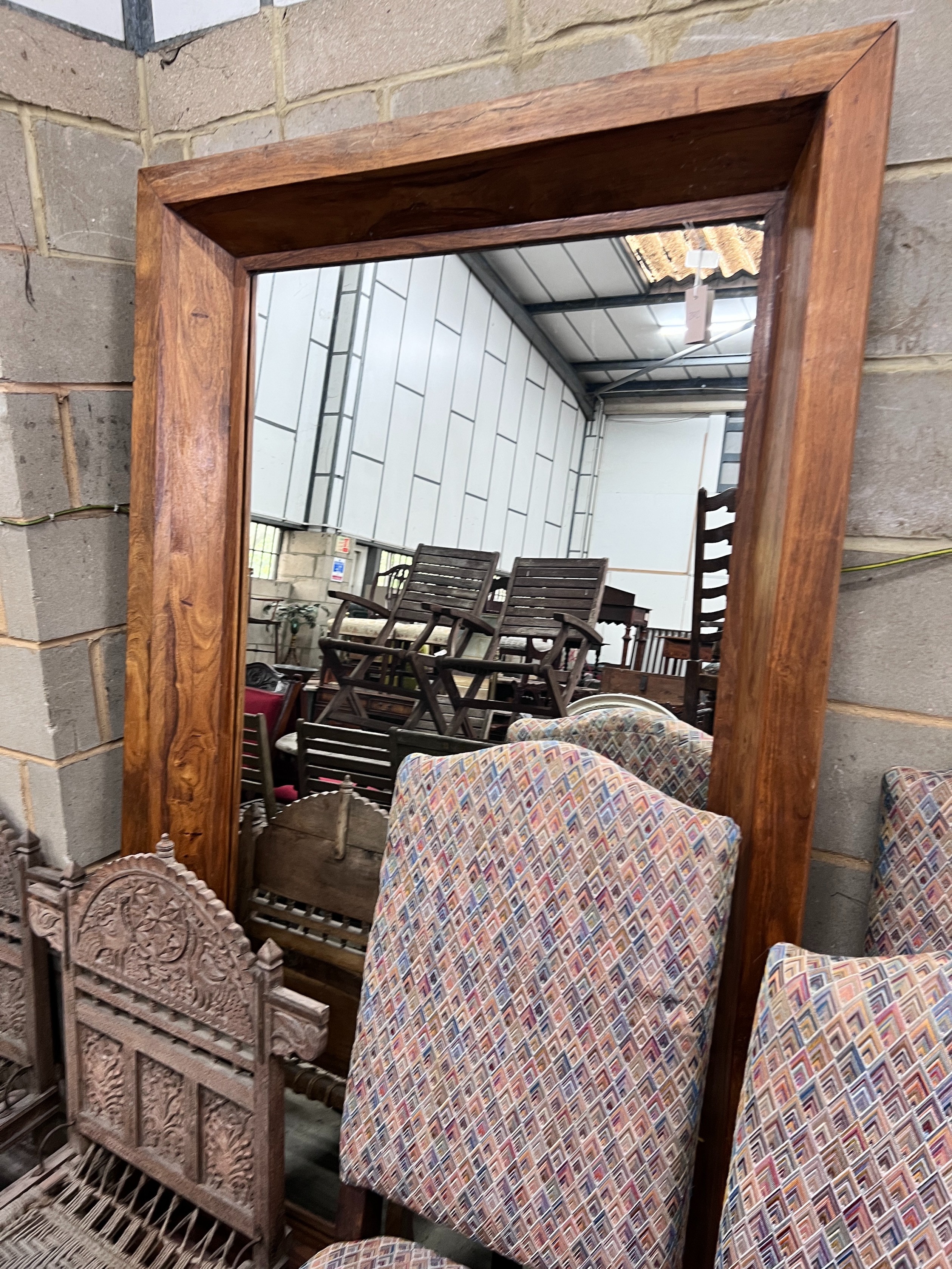 A heavy teak framed mirror, width 120cm, height 200cm *Please note the sale commences at 9am.